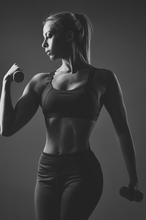 Fitness, dieting, sexy girl. Beauty, fashion, workout. fitness club Sensual woman with dumbbell, weightlifting.の写真素材