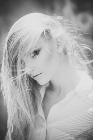 Beauty salon. Hair care. Woman with healthy hair care, treatment, therapy. Woman with long blond hair, hairstyle on sunny day. Girl with beauty look, makeup skin, skincare. Fashion model on summer vacationの写真素材