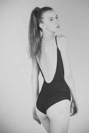 Sexy girl. Girl in black fashionable swimsuitの写真素材