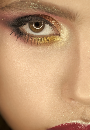 Makeup and cosmetics for skincare and beauty. Beauty woman face. Woman with professional makeup for brown eyes. Fashion model girl. Perfect skin with glamour makeup, skincare. Part of face, lookの写真素材