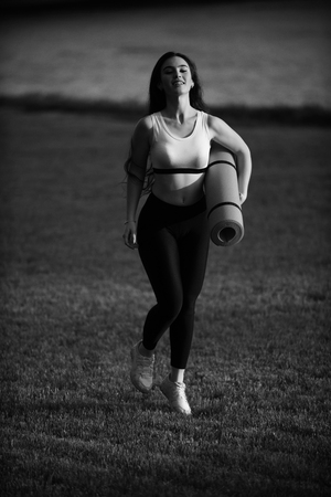 Sport and sportswear fashion. Coach or trainer at workout.の写真素材