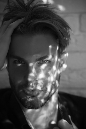 male fashion portrait. barber with unshaven face and beard.の写真素材