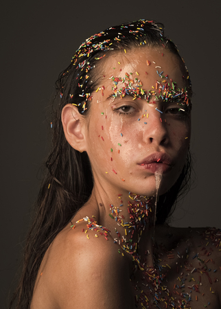 fashion portrait. Beautiful young woman with creative makeup, closeup.の写真素材
