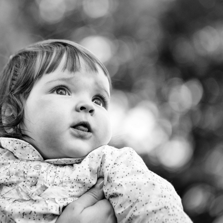 child looks with hope. Pretty baby girlの写真素材