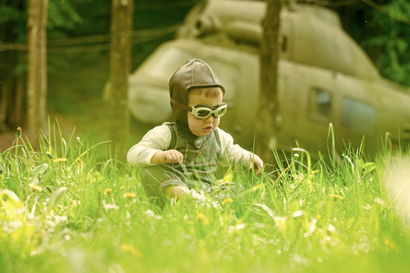 future profession. Child and blurred helicopter on natural backgroundの写真素材