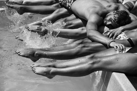 Summer rest. Man lies on female legsの写真素材