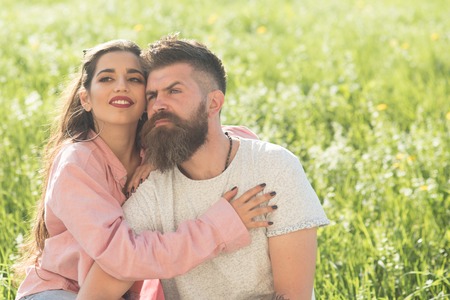Love is in the air. Sensual woman hug bearded man. Loving couple enjoy summer day together. Couple in love. Romance and intimacyの写真素材