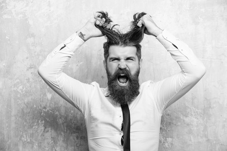 Male fashion, beauty and advertisement concept. man or hipster with long beard on shouting faceの写真素材