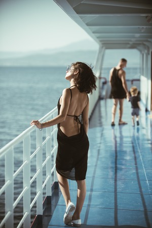 beautiful woman on ship with man and son. beautiful woman with little boy and man on yacht.の写真素材