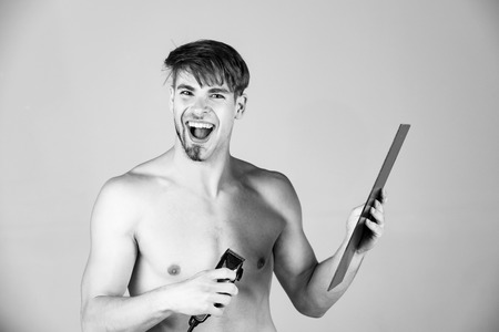 skincare hygiene, grooming. Beauty fashion portrait. fashion model with half shaven face and beardの写真素材