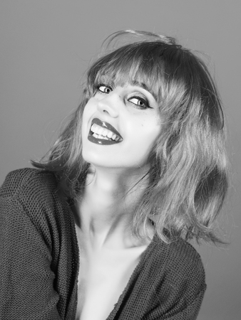 Beauty fashion portrait. Woman in red wig with fashionable makeup.の写真素材