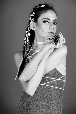 Fashionable woman posing. Fashionable woman in grey dress posing in studioの写真素材