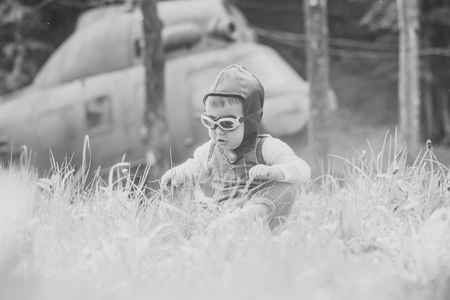 The future of aviation. Child and blurred helicopter on natural backgroundの写真素材