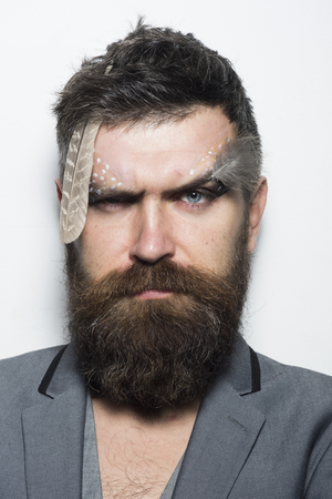 Hair salon. Man with long beard hair and makeup. Bearded man with stylish hair. Where hair becomes a masterpieceの写真素材