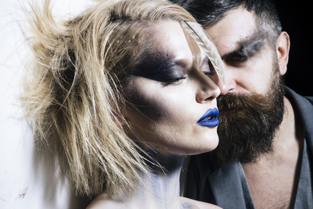Makeup couple. Sensual woman and bearded man with makeup and stylish hair. We makeup your face. Makeup and beauty.の写真素材
