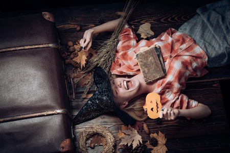 Holiday halloween with funny carnival costumes on a halloween background. 31 october. Sexy woman on Halloween background. Background decorated for Halloween.の写真素材