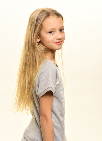 stylish kid. stylish kid with long blond hair. stylish kid isolated on white. stylish kid and beauty fashion.の写真素材