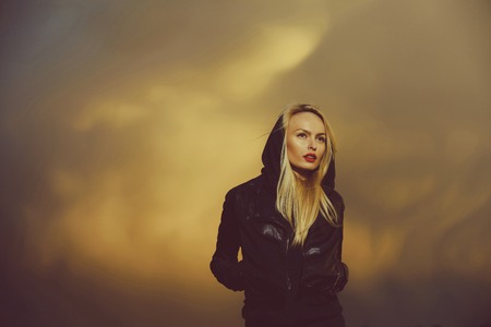 woman with red lips in leather jacket