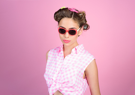 Pin up girl. happy girl in summer glasses. vintage housewife woman make hairstyle. retro woman with fashion makeup. beauty salon and hairdresser. Ambitious and beautiful. Perfect femaleの写真素材