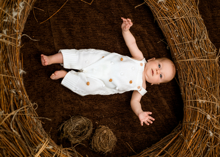 Newborn baby on health care. Newborn baby girl or boy awake in crib. Child health and growth. Emotional and physical growth. Changing and growing with you. Comfortable careの写真素材