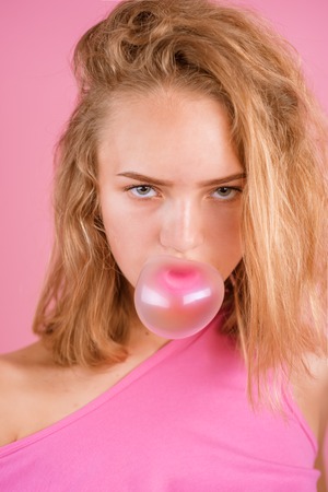Just be cool. Cool and nasty. Nasty girl chew bubble gum. Pretty girl with chewing gum. Blow your own bubble. How cool is thatの写真素材