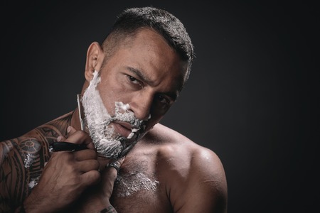 Professional hairstylist in barbershop interior. Hair Preparation is just for the dashing chap. Razor blade. Barber shop design. Barber Shop Studios. Barber scissors and straight razor.の写真素材