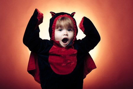 Holiday halloween with funny carnival costumes on red background. The Most Popular Candy for Halloween. Background decorated for Halloween. Happy halloween shirt.の写真素材