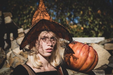 Close-up portrait of gorgeous blonde fairy. Portrait of women in halloween costumes over outdoor...