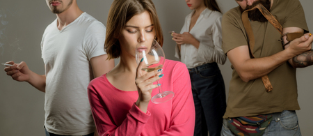 Serious sad woman having alcohol addiction. Psychologist theraphy social problems concept alcohol addiction. Stop alcohol addiction. Alcoholic Addictionの写真素材