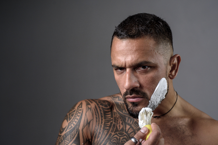 Latin man Shaving. Beard styling cut. Ideas about Barbershop and Barber salon.の写真素材