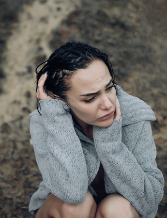 Sad woman Unhappy and stressed - family problems concept. A sad beautiful woman crying.の写真素材