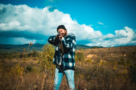Wildlife Hunting. Hunter with shotgun gun on hunt.の写真素材