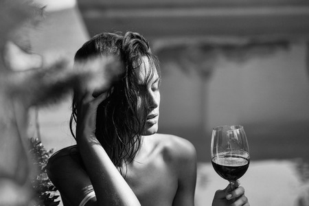 sexy pretty girl drinking red wineの写真素材