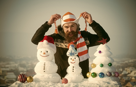 Man holding hat strings in handsの写真素材