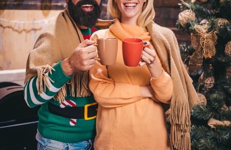 Christmas hot mulled wine. Happy family preparing to new year. Christmas holiday party.の写真素材