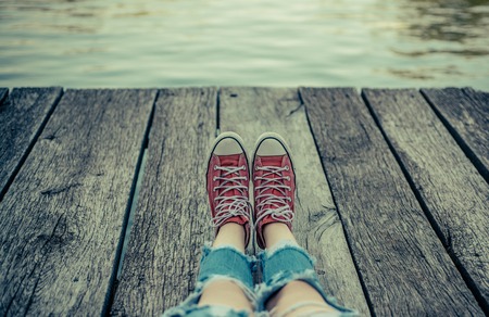 Adventure Time for People. Camping and adventure background. Childrens adventure concept. Red sneakers on camping.の写真素材