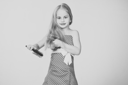 hairdresser and barbershop. hairdresser, long hair of little girl.の写真素材
