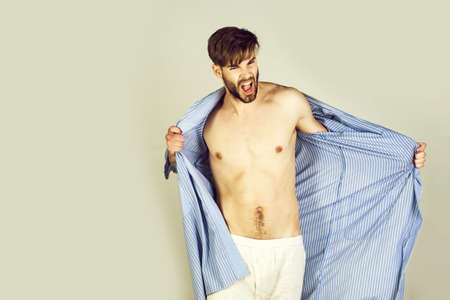 young shouting man in bathrobeの写真素材