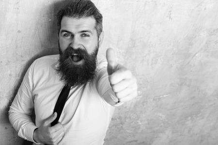 man or hipster with long beard on happy faceの写真素材