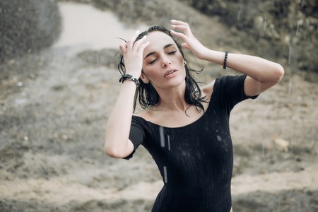 Woman in rain. Picture emotion woman. Girls cry. Sad female mood. Woman emotions.の写真素材