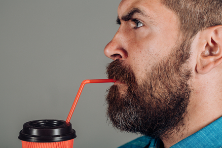 brutal bearded man with take away coffee. male with beard. mature hipster drink coffee. full of energy. Good morning coffee. Getting warm with fresh coffee. Fresh drink tastes deliciousの写真素材
