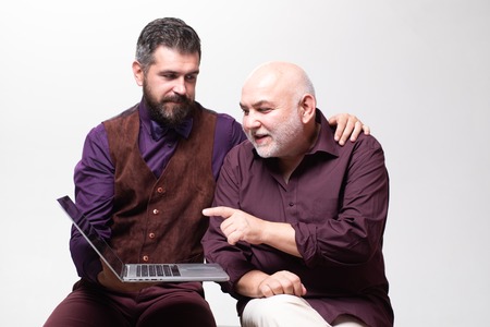 Son is Tutor. Family Teacher concept. Old father and son. Fathers day. Comical dad and son. Happy family.の写真素材