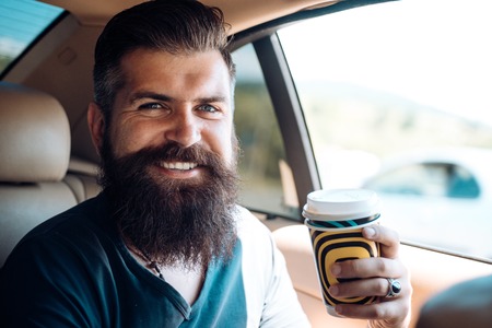 brutal caucasian hipster with moustache. Male barber care. Mature hipster with beard. Bearded man. Enjoying morning coffee. So happy. Lucky to start the day hereの写真素材
