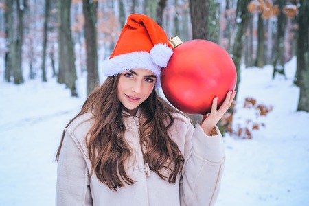 Winter woman happy. Winter portrait of young woman in the winter snowy scenery. What happens during...