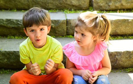 best friends, friendship and family values. summer holiday and vacation. childhood first love. small girl and boy on stairs. Relations. couple of little children. Boy and girl. summer morning.の写真素材