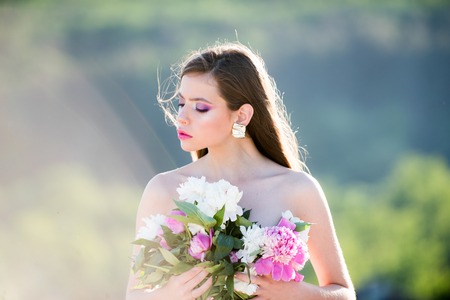 Natural beauty and spa therapy. flowers. Face and skincare. Travel in summer. Woman with fashion makeup. Spring woman. Springtime and vacation. Summer girl with long hair. Living in the moment.の写真素材