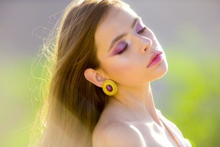 Spring woman. Springtime and vacation. Woman with fashion makeup. face and skincare. Travel in summer. Summer girl with long hair. Natural beauty and spa therapy. Hot day.の写真素材