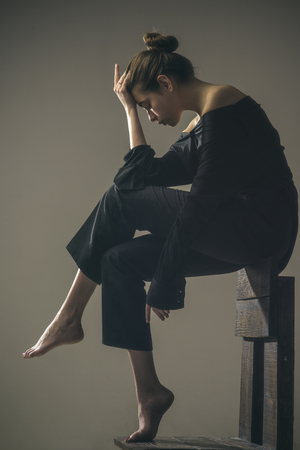 Woman with trendy look. Beauty and fashion. Fashion woman full length. Solitude. Modern girl. Loneliness. empty nest. i have a big problem. Feeling lonely at those moments.の写真素材
