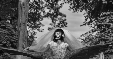 bride with orange hair in blue veilの写真素材