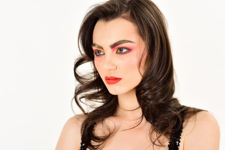 Making my skin feel amazing. Sexy woman with color cosmetics. Pretty woman wear creative makeup. Beauty model with glamour look. A beauty of a girl. Applying decorative cosmetics and makeup.の写真素材